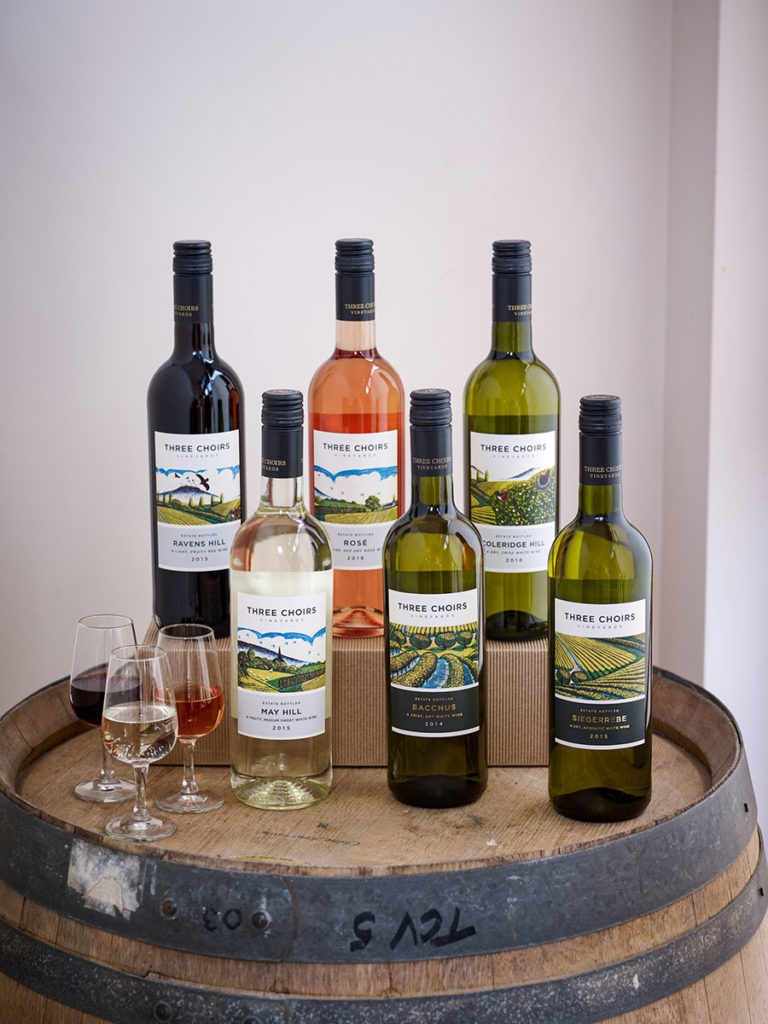 Three-Choirs-Vineyards-Wine-Bottles-On-Barrell